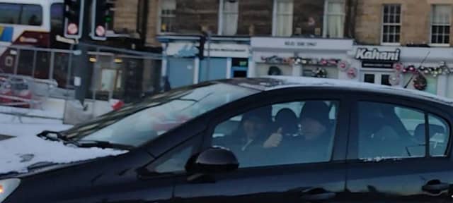 Mr Walters took a photo of the driver who appears to smile as he's caught breaching no-left turn