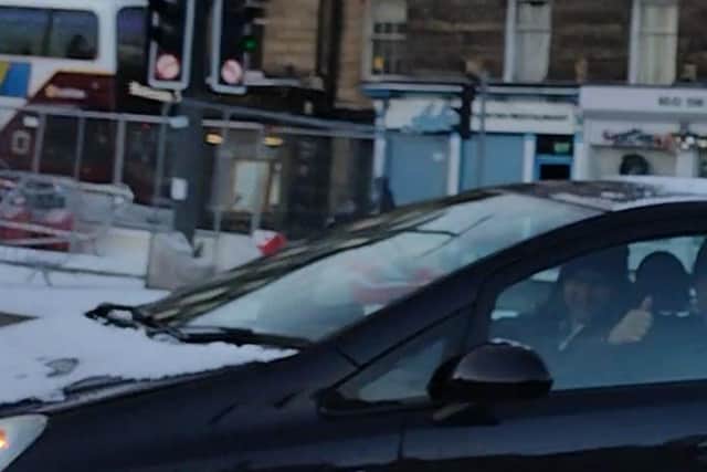 Mr Walters took a photo of the driver who appears to smile as he's caught breaching no-left turn