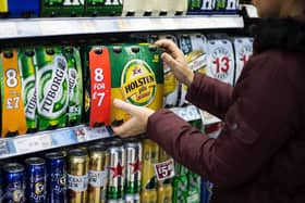 A consumer purchases beer from a supermarket in Scotland. Picture: John Devlin