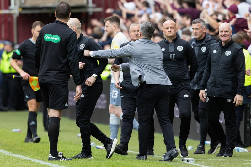 Lee Johnson steps towards the Hearts technical area at full-time