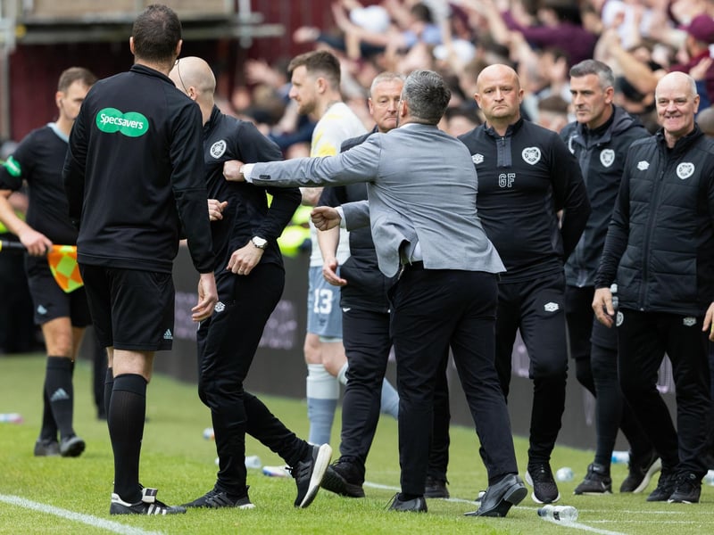 Lee Johnson steps towards the Hearts technical area at full-time