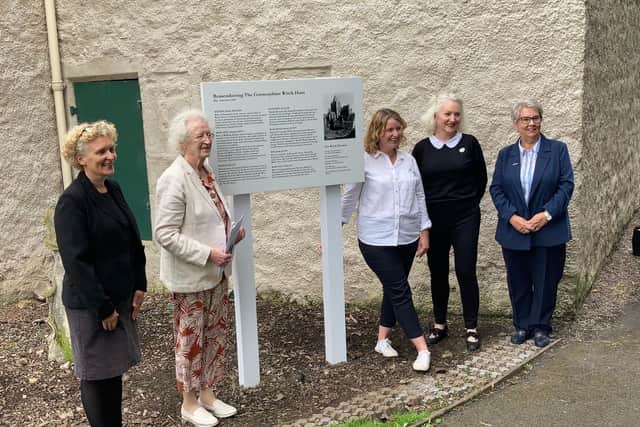 The plaque remembering the Corstorphine witches has been erected outside Dower House in Edinburgh.