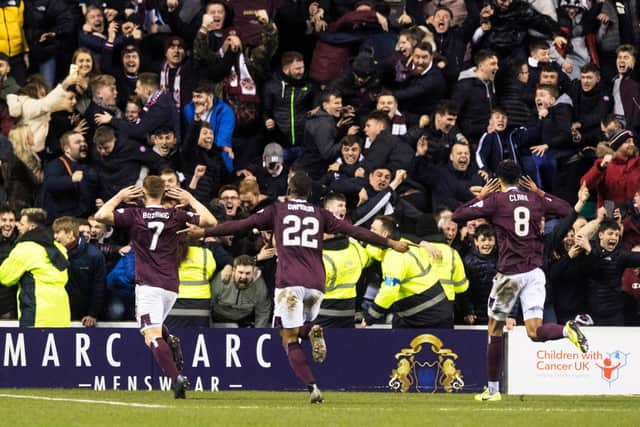 Hearts fans were ecstatic with the result and performance at Easter Road. Picture: SNS