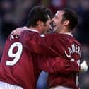 Stephane Adam celebrates with Hearts team-mate Colin Cameron. Picture: SNS