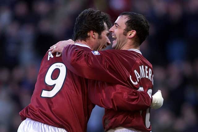 Stephane Adam celebrates with Hearts team-mate Colin Cameron. Picture: SNS