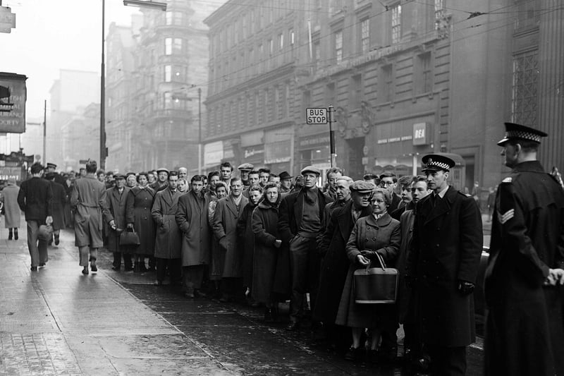 Football fans queue in Glasgow for Tickets to Celtic v Rangers - New Years Day Match