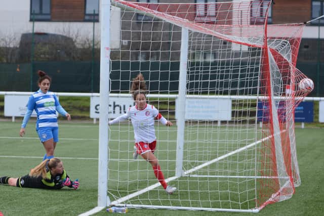 Spartans’ Louise Mason scores one of her two goals on her 200th appearance. Picture: Mark Brown