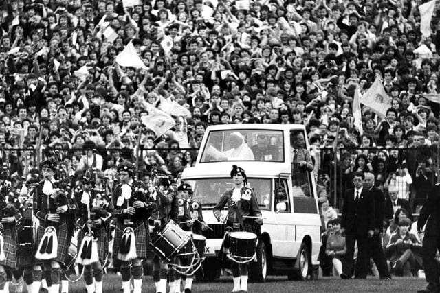 Crowds of young people welcome Pope John Paul II to Murrayfield Stadium during his 1982 visit to Scotland.