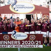 Hearts celebrate winning the Championship title in April.