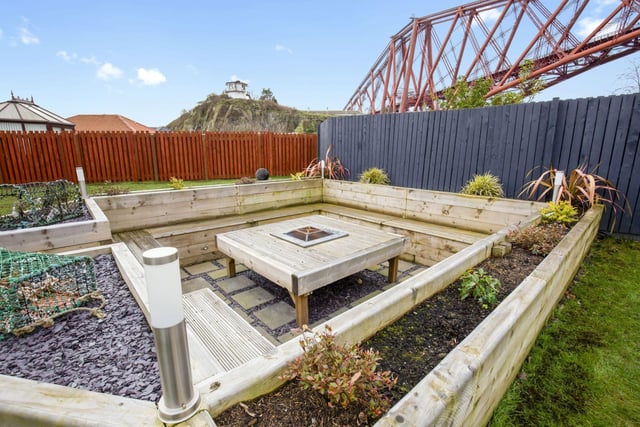 The rear garden is laid mainly laid to lawn, featuring a sunken fire pit with surround seating, along with a large patio area, making it perfect for al fresco dining and outdoor entertaining.