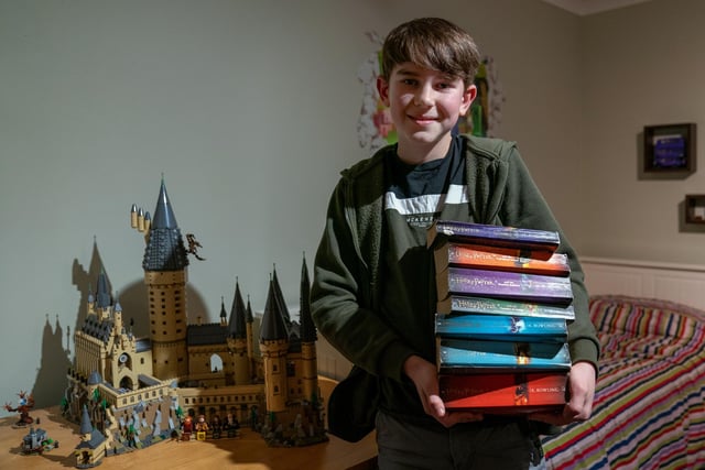 Eli Chmelik, 11, who has set the Guinness World Record for identifying the most Harry Potter characters from quotes from the Harry Potter films in one minute, at his home in Manningtree, Essex. Eli successfully identified 19 quotes. Picture date: Wednesday January 26, 2022.