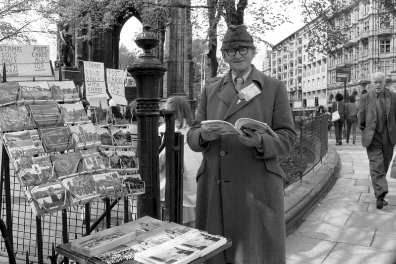 Harry Tranter  a well known Edinburgh character, selling  postcards at the junction of Princes Street and Waverley Bridge in June 1986.