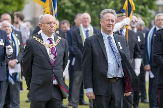 Lord Provost of the City of Edinburgh Robert Aldridge (left) joins Cabinet Secretary for Justice and Veterans Keith Brown MSP (right) and senior military personnel, as well as Falklands veterans and members of the wider armed forces community, to remember the 40th anniversary of the end of the conflict, during a parade and service of remembrance in Edinburgh. Picture date: Saturday June 18, 2022.