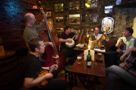 You can't beat a bit of live music at the pub. Pictured are folk musicians at Quarters Pub at Bernard Street in Leith in 2001. Pictured left to right are Craig Mckinney (mandolin), Shug Kelly (double bass) and Dennis Arnold (banjo), Colin Whitelaw (Octave mandolin) and John Dignan (guitar).