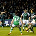 Hibs defenders are powerless to stop Aaron Mooy opening the scoring for Celtic at Easter Road. Picture: SNS
