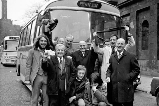 Hibs fans who won an Evening News competition to attend the final get ready to board their bus to Hampden
