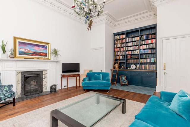 The West End property features elegant décor including beautiful wooden floors and a traditional fireplace