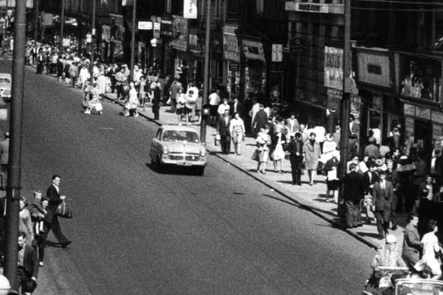 King Street in 1963. Look how busy it is but what is the car on the street?