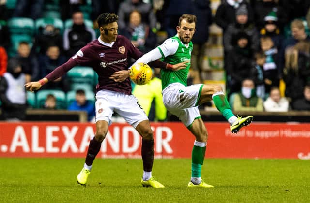 Sean Clare and Christian Doidge in action during the last Edinburgh derby match between Hibs and Hearts at Easter Road