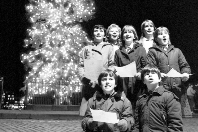 Carrick Knowe Primary School pupils singing carols as the Mound's Christmas tree lights were switched on in December 1984.