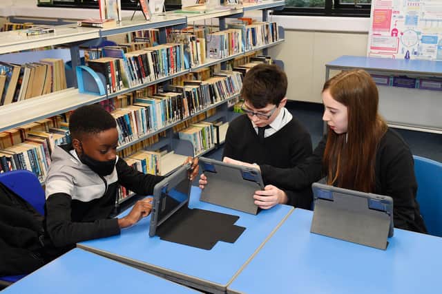 Councillors Adam McVey and Joan Griffiths visit Leith Academy where pupils are being given new iPads… Jeffrey (12), Jaydan (12) and Oliwia (12)