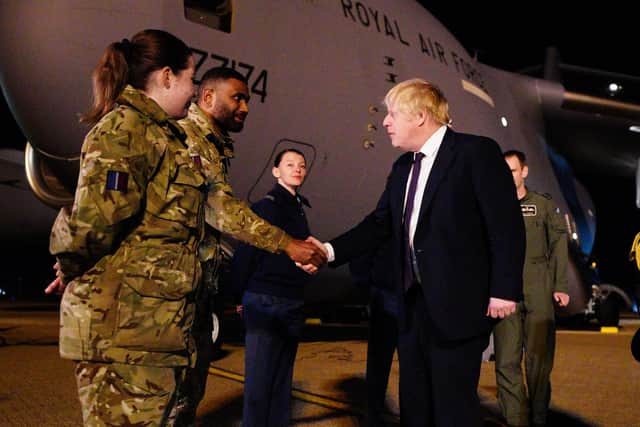 Prime Minister Boris Johnson meeting military personnel at RAF Brize Norton in Oxfordshire to thank them for their ongoing work facilitating military support to Ukraine and NATO. Picture date: Saturday February 26, 2022.