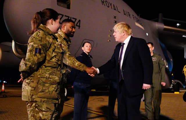 Prime Minister Boris Johnson meeting military personnel at RAF Brize Norton in Oxfordshire to thank them for their ongoing work facilitating military support to Ukraine and NATO. Picture date: Saturday February 26, 2022.