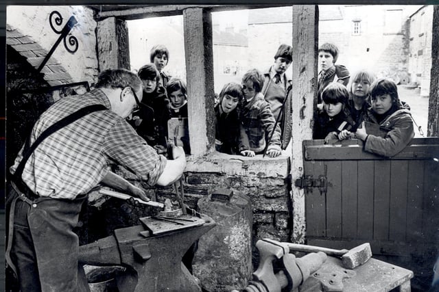 Abbeydale Industrial Hamlet in March 1978 which was popular as ever as youngsters watch a craftsman at work during one of the working days