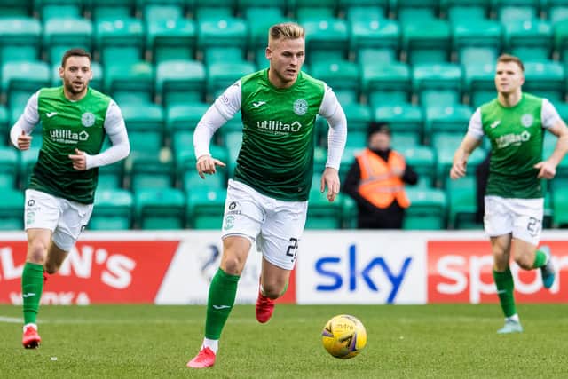 James Scott in possession for Hibs during the win over Ross County with Drey Wright behind him and Chris Cadden in the distance. Picture: SNS