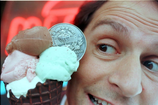 Mr Josef Boni wins the 1999 ice cream industry British Championship award for his vanilla ice cream. Medal is shown in the photograph.