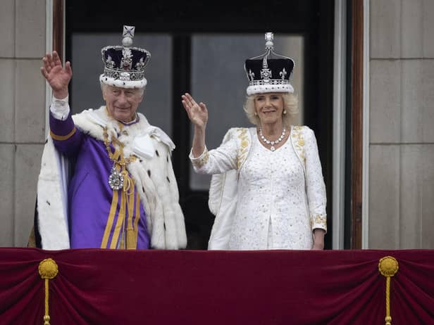 King Charles III and Queen Camilla wave to the crowds from the balcony at Buckingham Palace (Picture: Christopher Furlong/Getty Images)