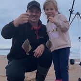 Chris Empson and his daughter Abby at a local beach. Picture: Nigel Duncan