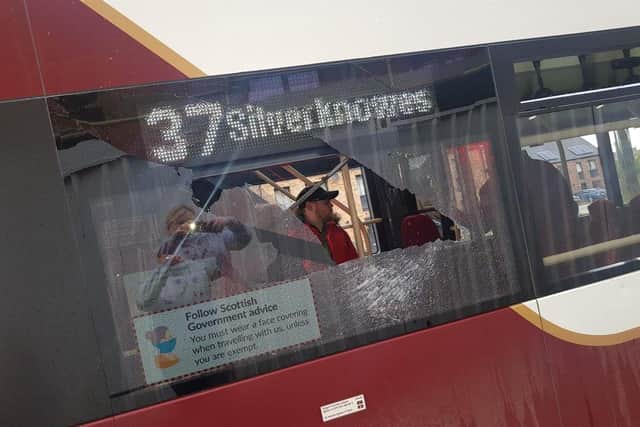 Targeted: Thugs smashed this bus window