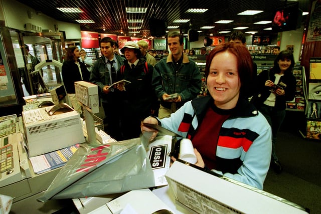 Sarah Myles (17) from Baberton was the first person in Edinburgh to buy the hotly-anticipated third Oasis album 'Be Here now' at the HMV store in the St. James' Centre in the summer of 1997.