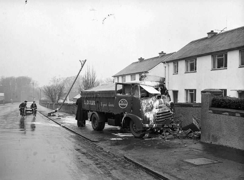 A lorry is seen crashed into a wall after an accident on Gilmerton Road in 1960.