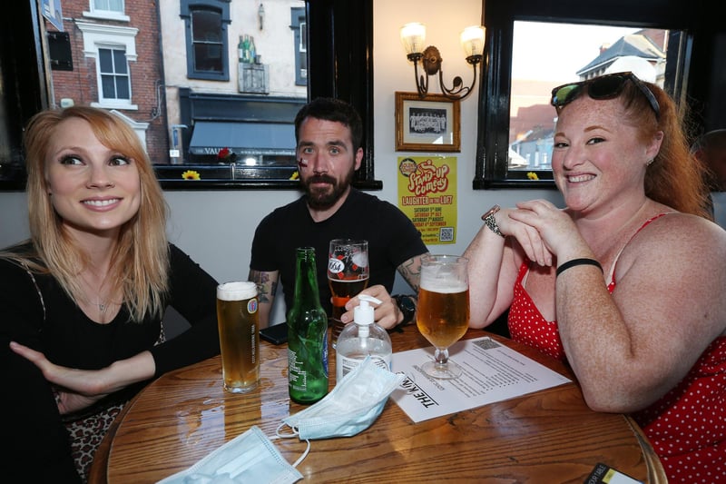 From left, Anna Weller, SJ James and Alice Monard. Fans watch England v Ukraine in the quarter finals of Euro 2020, in The Kings pub, Albert Rd, Southsea. Picture: Chris Moorhouse (jpns 030721-18)