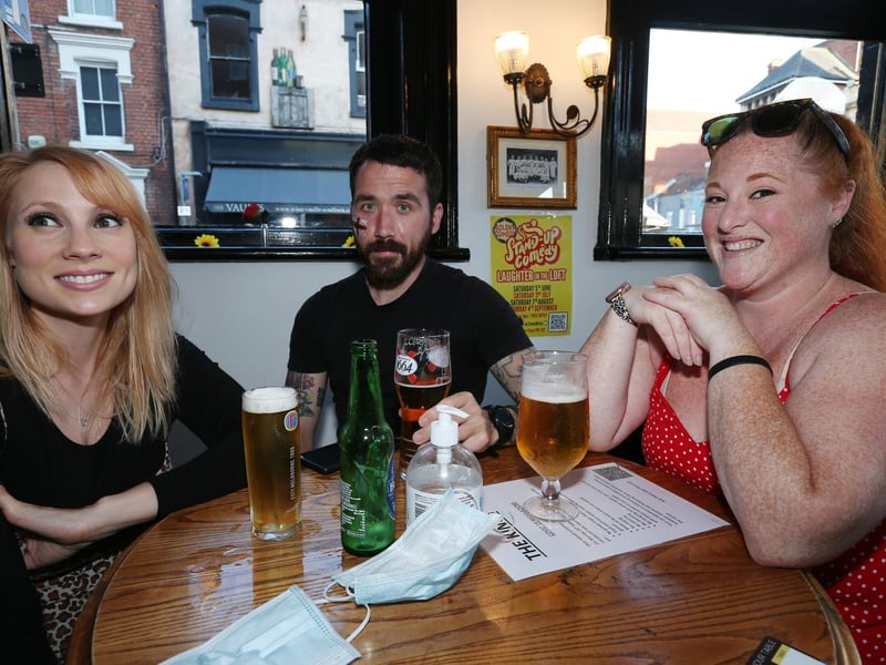 From left, Anna Weller, SJ James and Alice Monard. Fans watch England v Ukraine in the quarter finals of Euro 2020, in The Kings pub, Albert Rd, Southsea. Picture: Chris Moorhouse (jpns 030721-18)