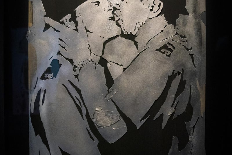 Stencil featuring kissing policemen in the new show by artist Banksy 'Cut & Run' which opens this Sunday at Glasgow's GoMA, revealing for the first time the stencils used to create many of the artist's most iconic works.