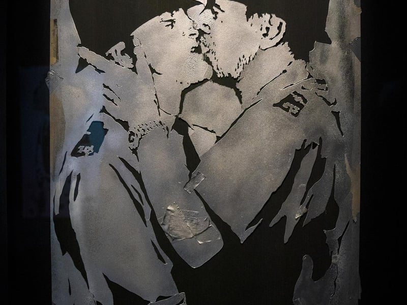 Stencil featuring kissing policemen in the new show by artist Banksy 'Cut & Run' which opens this Sunday at Glasgow's GoMA, revealing for the first time the stencils used to create many of the artist's most iconic works.