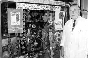 Edinburgh grocer William Archibald decorated the window of his shop in Roseneath Street with flags and poppies for Remembrance Day 1981.