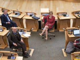 Scottish Green Party co-leaders Patrick Harvie (left) and Lorna Slater (right) and First Minister Nicola Sturgeon (centre) in the main chamber of the Scottish Parliament, Edinburgh, as the Scottish Green Party co-leaders are formally appointed as junior ministers. Picture date: Tuesday August 31, 2021. PA Photo. See PA story POLITICS Scotland. Photo credit should read: Jane Barlow/PA Wire 