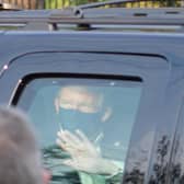 Covid patient Donald Trump waves to supporters outside Walter Reed National Military Medical Center from his hermetically sealed vehicle, an environment conducive to passing on the virus to the other people inside. (Picture: Tony Peltier/AP)