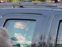 Covid patient Donald Trump waves to supporters outside Walter Reed National Military Medical Center from his hermetically sealed vehicle, an environment conducive to passing on the virus to the other people inside. (Picture: Tony Peltier/AP)