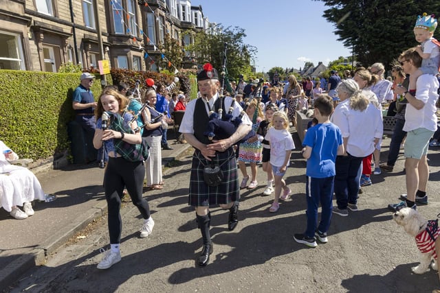 Bagpipers entertain residents of Netherby Drive in Trinity to mark Jubilee celebrations. (Photo by Robert Perry/Getty Images)
