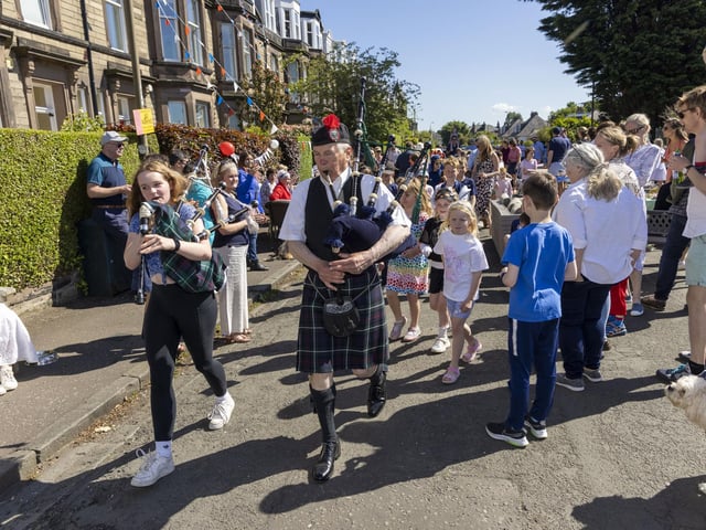 Bagpipers entertain residents of Netherby Drive in Trinity to mark Jubilee celebrations. (Photo by Robert Perry/Getty Images)