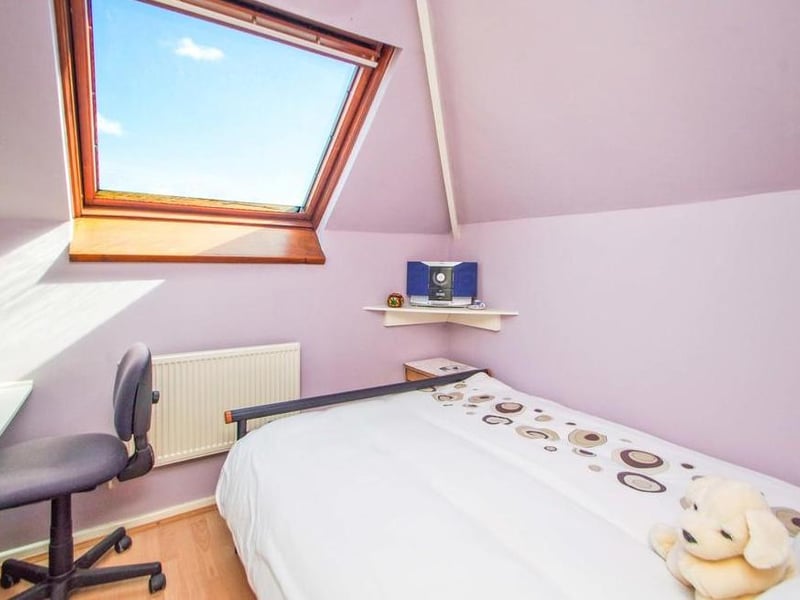 Here is the second bedroom. Compact but bright and relaxing.