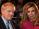 Prime Minister Boris Johnson with his partner Carrie Symonds, who are understood to be taking their son on a holiday to Scotland.  Picture: JEREMY SELWYN/POOL/AFP via Getty Images.