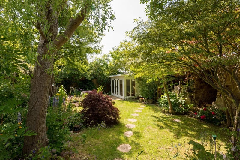 The private garden comes with mature planting, an organic vegetable patch, summerhouse and patio.