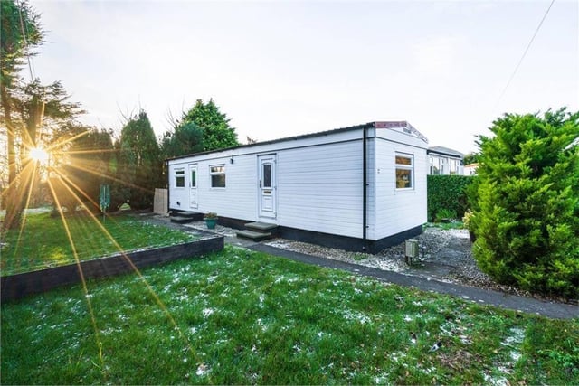 The most affordable property on the list, still available for £70,000, is this modern one-bed mobile home in Midlothian. The home has all the quality of a new-built property with a fully-fitted modern kitchen with a breakfast bar, a wall-mounted TV and sleek cabinets. The bedroom includes built-in wardrobes and the stylish bathroom has a walk-in shower cubicle.