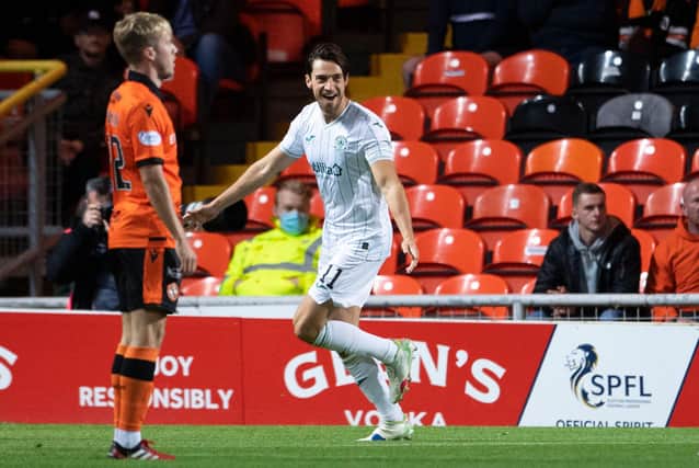 Joe Newell celebrates his opener at Tannadice in the Premier Sports Cup quarter-finals
